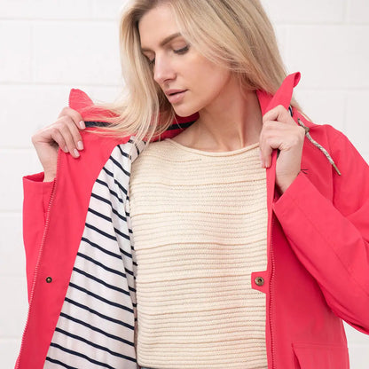 Woman in a pink jacket with striped lining from Lighthouse Ladies Beachcomber II Coat