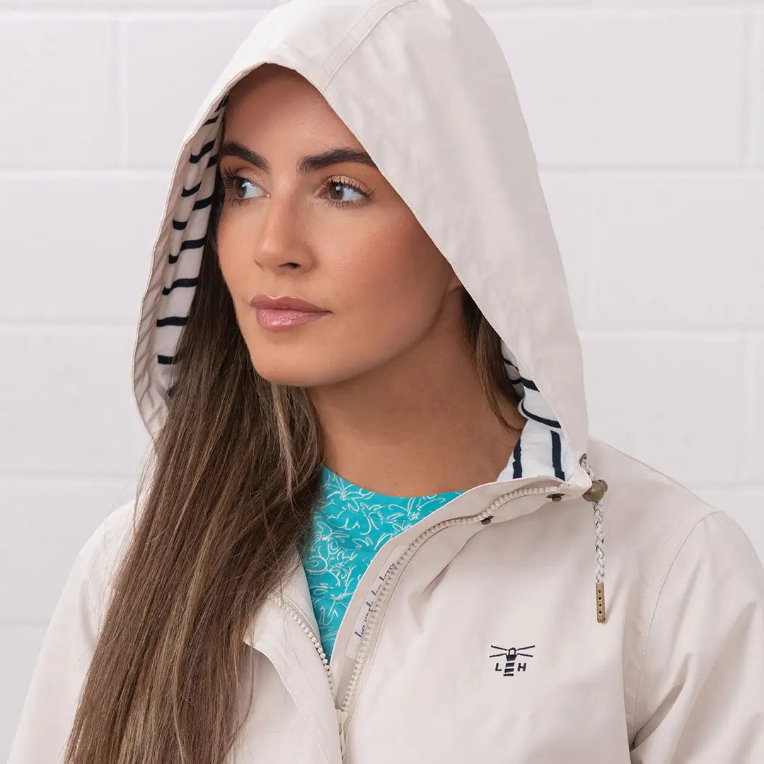 Beige hooded rain jacket from the Lighthouse Ladies Beachcomber Long II Coat line