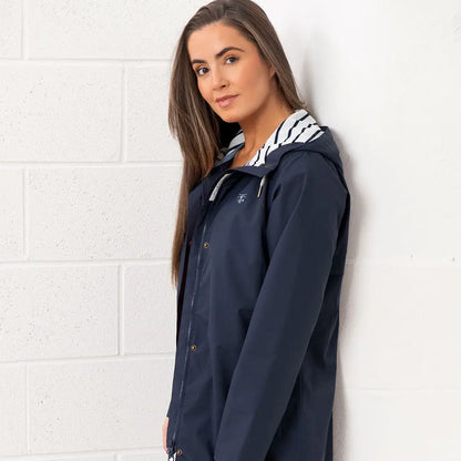 Navy blue hooded raincoat from the Lighthouse Ladies Beachcomber Long II Coat collection