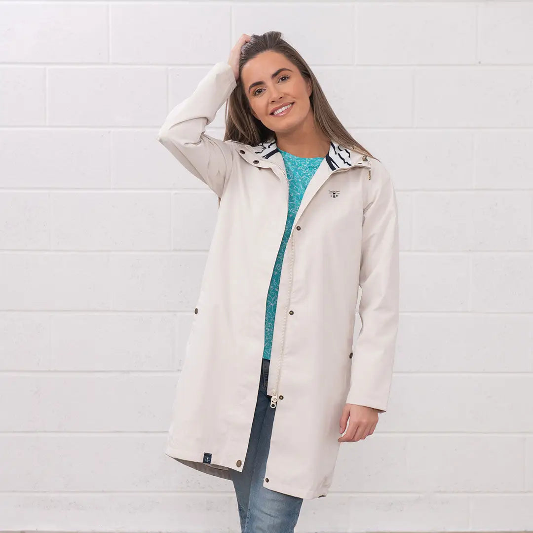 Woman in a beige Lighthouse Ladies Beachcomber Long II Coat ready for rainy days