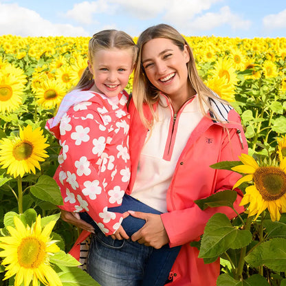Smiling mother and daughter in sunflower field wearing Lighthouse Ladies Beachcomber Long II Coat
