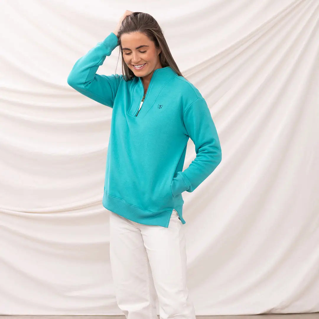 Woman in lighthouse ladies coral jersey sweatshirt showing off lighthouse ladies coral style