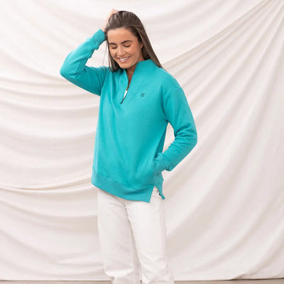 Woman in lighthouse ladies coral jersey sweatshirt showing off lighthouse ladies coral style