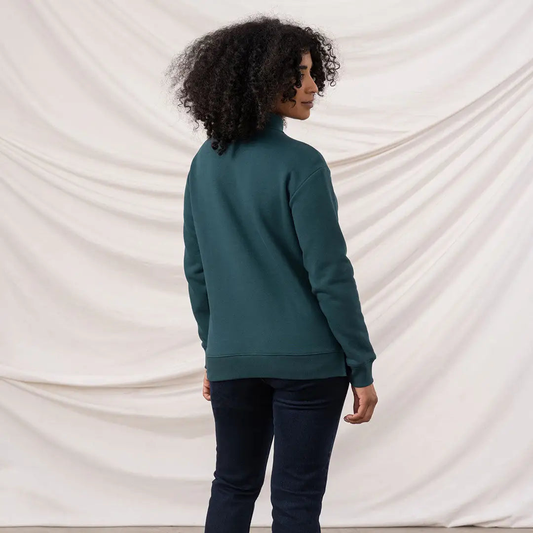 Person wearing Lighthouse Ladies Coral Jersey turtleneck and dark blue jeans