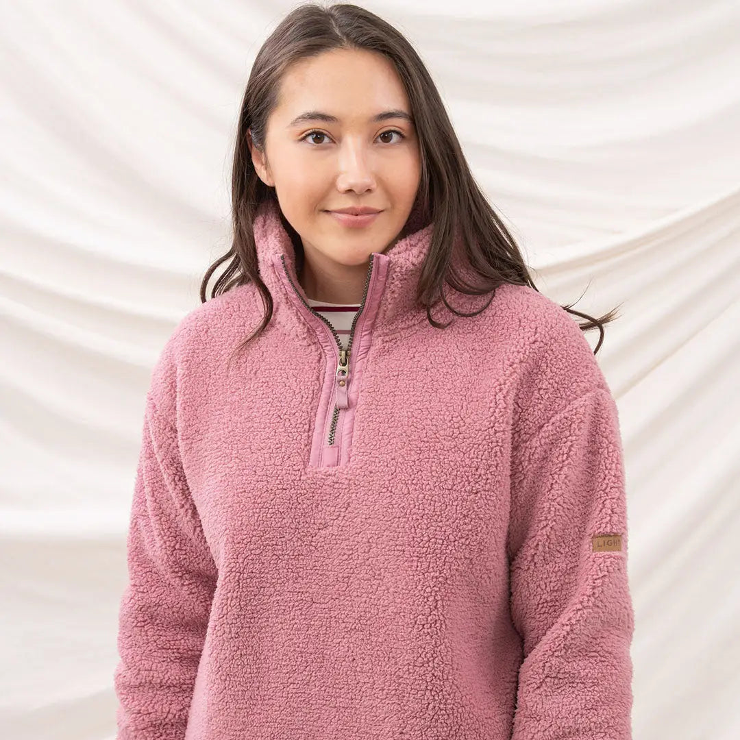 Cozy pink Lighthouse Ladies Coast Fleece half-zip pullover perfect for chilly days