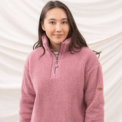 Cozy pink Lighthouse Ladies Coast Fleece half-zip pullover perfect for chilly days