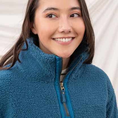 Young woman wearing Lighthouse Ladies Coast Fleece teal half-zip pullover