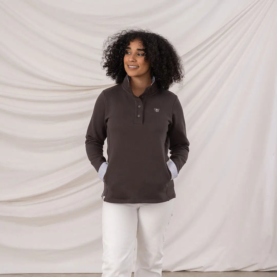 Lighthouse Ladies Haven II Jersey dark gray long-sleeve pullover with white collar and emblem