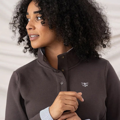 Woman in Lighthouse Ladies Haven II Jersey quarter-snap sweatshirt with striped cuffs