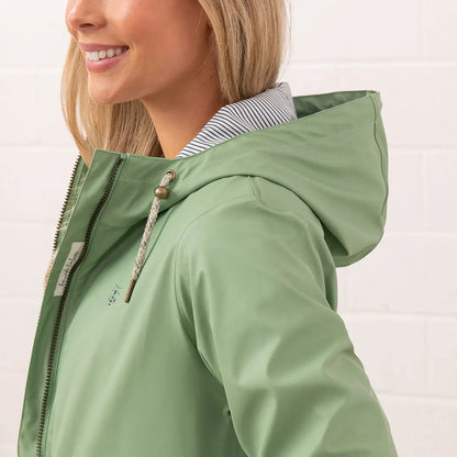 Green hooded raincoat from Lighthouse Ladies Lucy Coat, perfect for rainy days