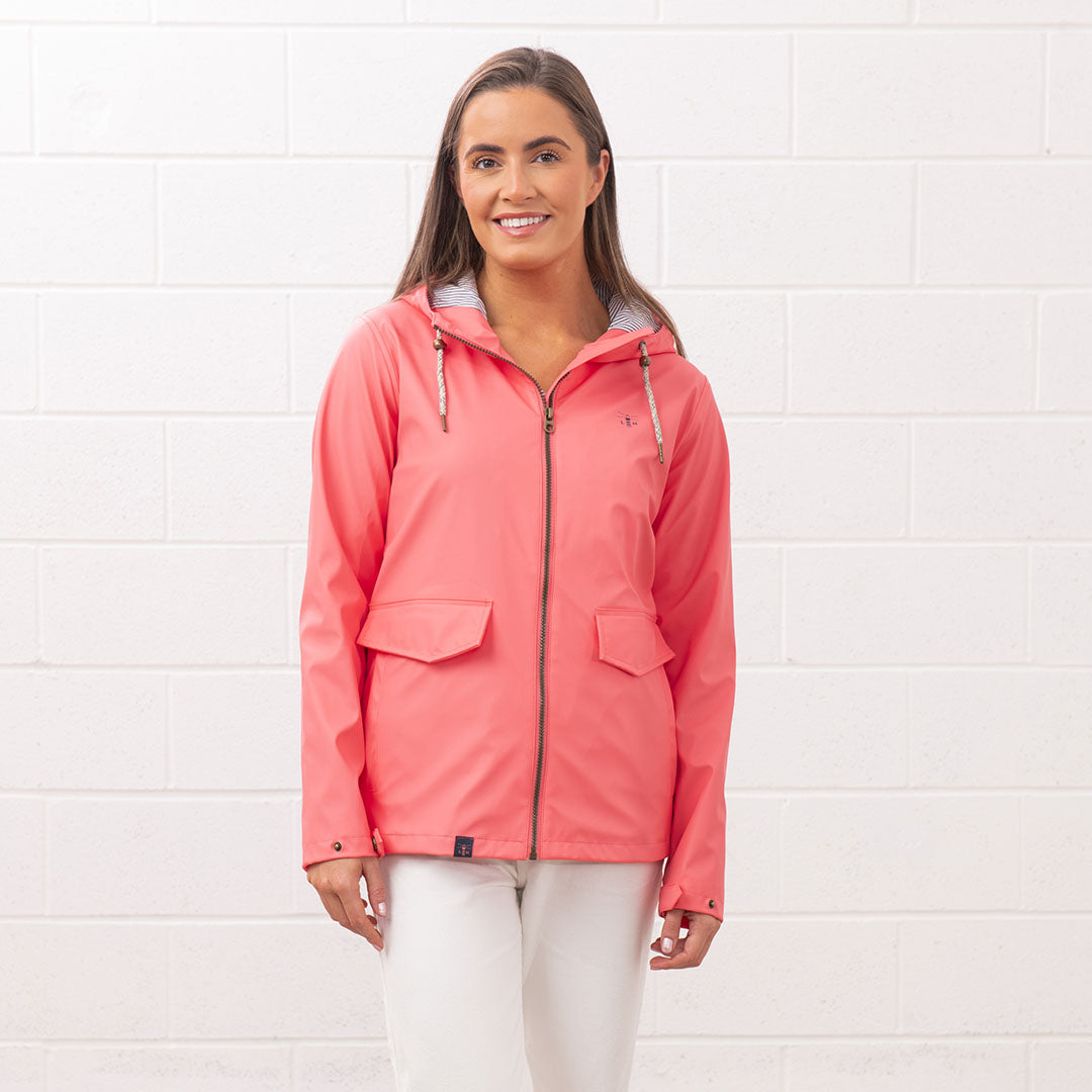 Coral-colored Lighthouse Ladies Lucy Coat, perfect for stylish rainy days