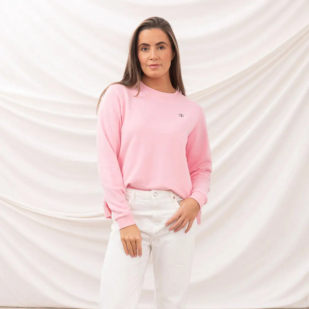Woman in pink sweatshirt and white pants wearing Lighthouse Ladies Seaside Jersey