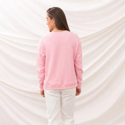 Pink sweatshirt and white pants from Lighthouse Ladies Seaside Jersey collection