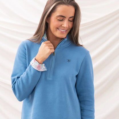 Blue quarter-zip sweatshirt from the Lighthouse Ladies Shore II Jersey collection
