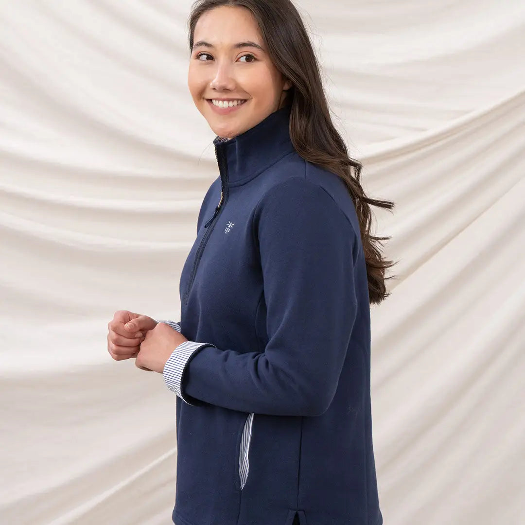 Smiling woman in Lighthouse Ladies Shore II Jersey navy quarter-zip pullover