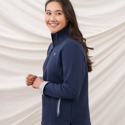 Smiling woman in Lighthouse Ladies Shore II Jersey navy quarter-zip pullover