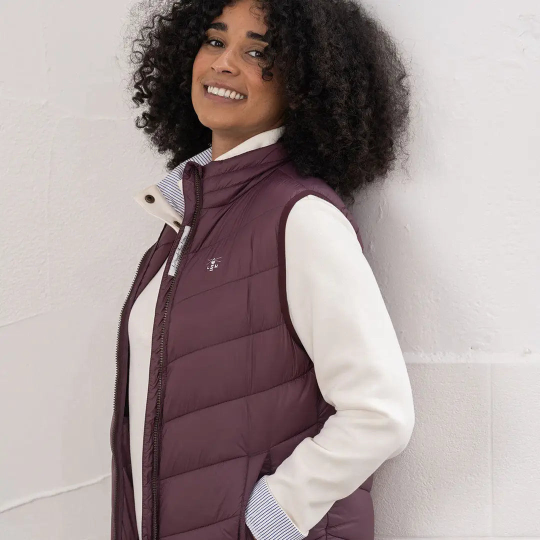 Lighthouse Laurel ladies burgundy puffer vest with striped collar and white shirt