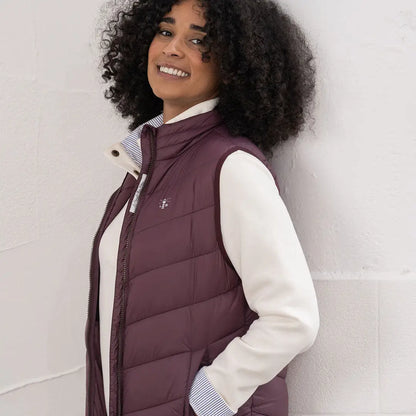 Lighthouse Laurel ladies burgundy puffer vest with striped collar and white shirt