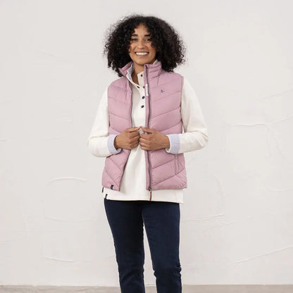 Lighthouse Laurel ladies pink quilted vest with cream top and dark blue trousers