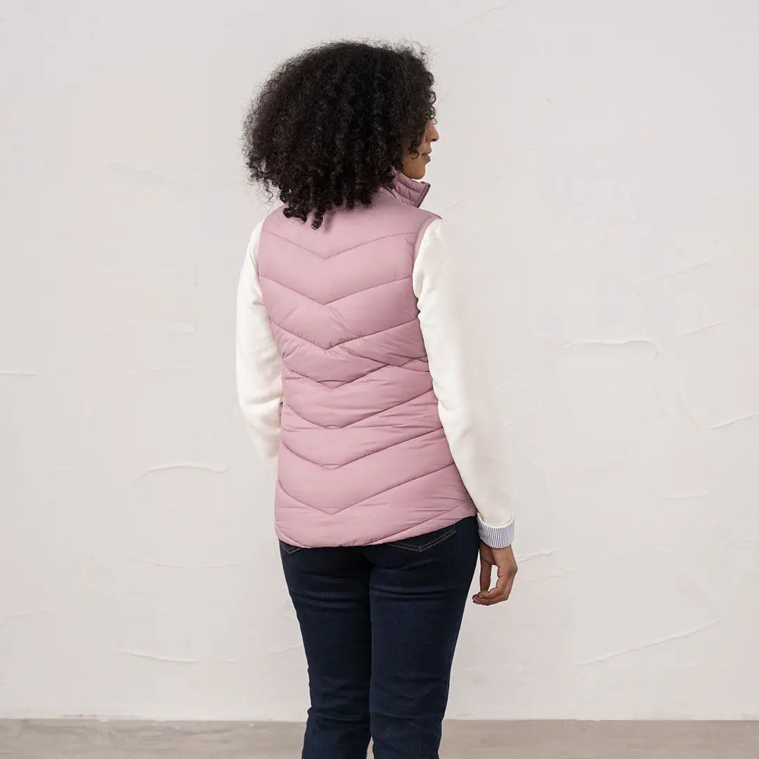 Pink quilted Lighthouse Laurel ladies gilet over white long sleeve shirt for stylish layering