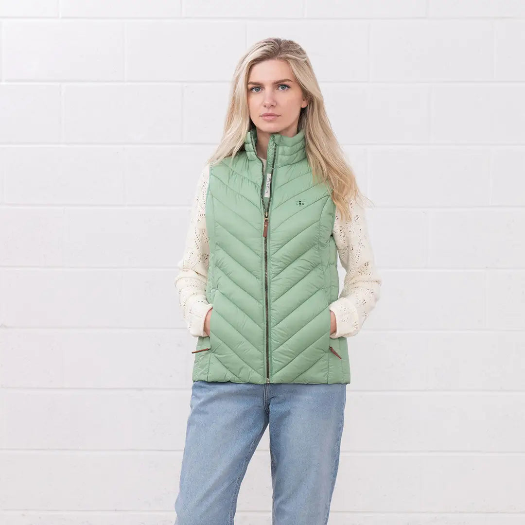 Woman in a light green Lighthouse Laurel Gilet perfect for any casual outing