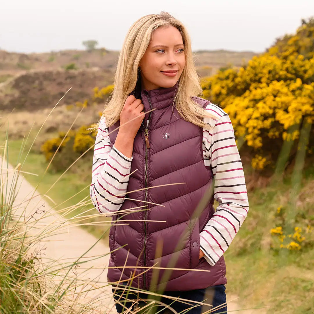 Lighthouse Laurel ladies plum quilted vest over striped shirt for casual style