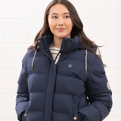 Young woman in navy blue Lighthouse Margot Ladies coat with striped shirt inside