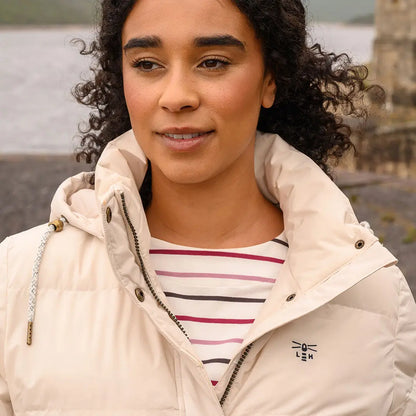 Woman in cream puffer jacket with striped shirt wearing Lighthouse Margot Ladies Coat
