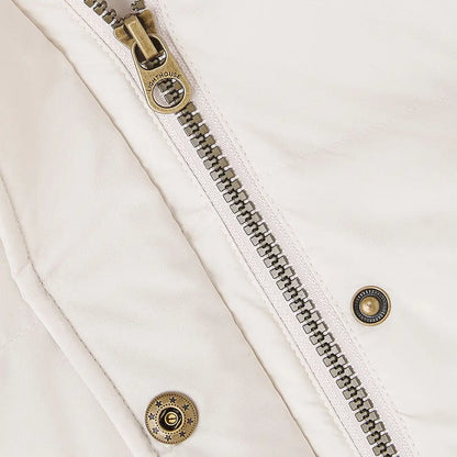 Lighthouse Margot Ladies coat with cream color, brass zipper, and decorative snap buttons