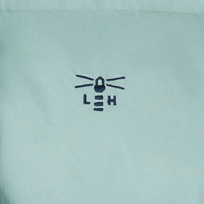 Embroidered lighthouse logo on light blue Lighthouse Margot Ladies Coat fabric