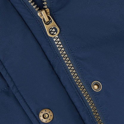 Close-up of Lighthouse Margot Ladies Coat with blue fabric and brass zipper details