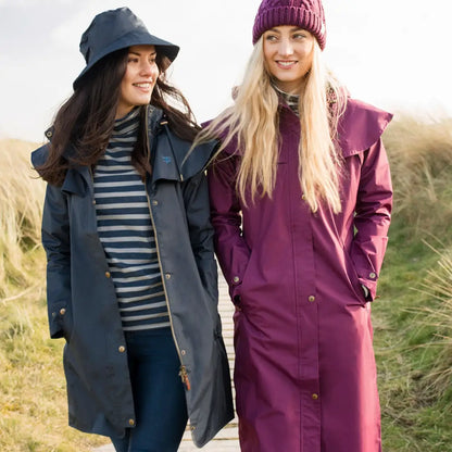 Two women in Lighthouse Outback Full Length Ladies Waterproof Raincoats outdoors