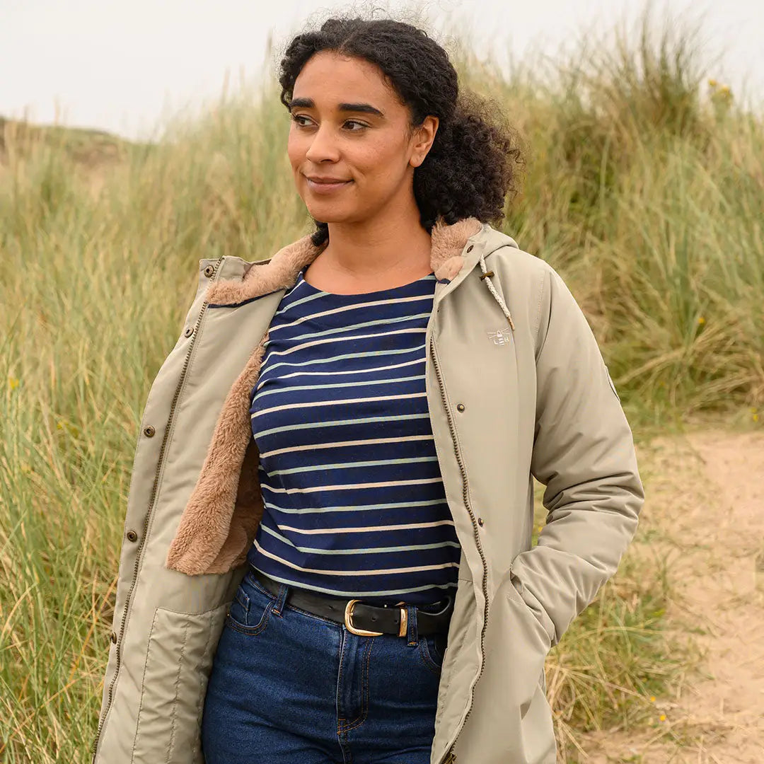 Woman in Lighthouse Scarlet Ladies Coat, perfect for country clothing and outdoor adventures