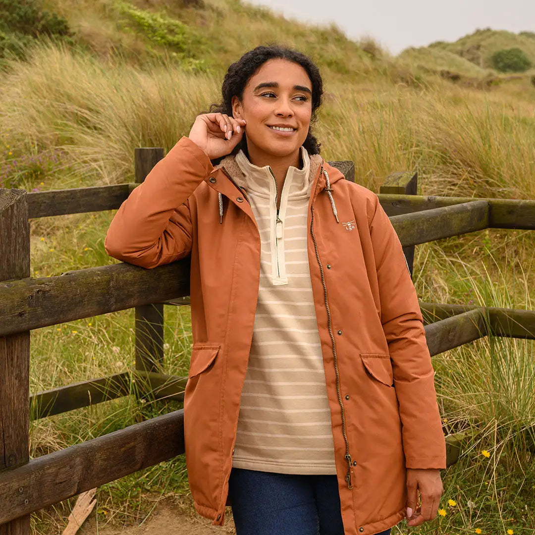 Woman in Lighthouse Scarlet Ladies Coat showing rust waterproof jacket for country outdoor hunting style