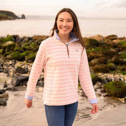 Smiling young woman in Lighthouse Shore cotton jersey sweatshirt, pink and white stripes