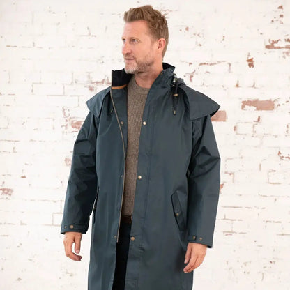 Long teal raincoat from Lighthouse Stockman, perfect for a cold winter’s day