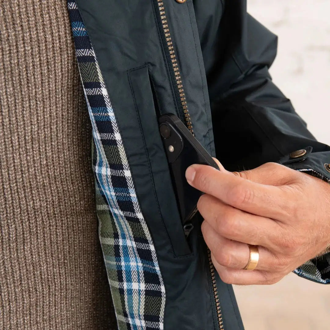 Dark green Lighthouse Stockman coat with plaid lining for a cold winter’s day