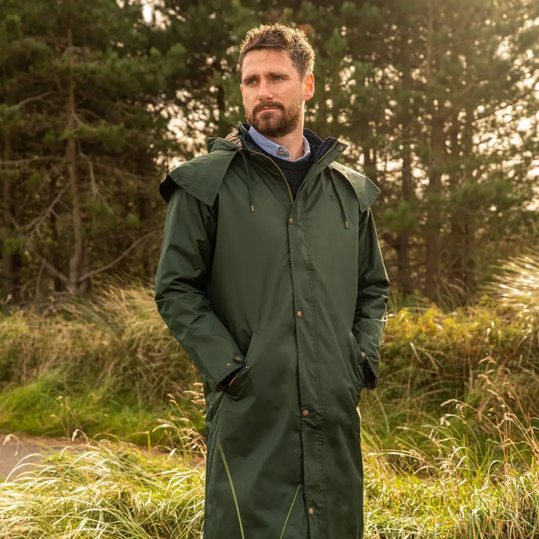 Dark green Lighthouse Stockman full length waterproof rain coat with a hood