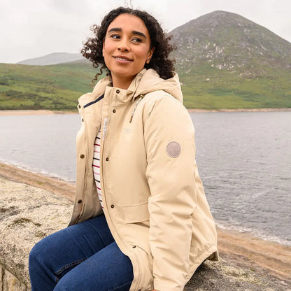 Woman in Lighthouse Tess Ladies Coat with beige puffer jacket and blue jeans for outdoors country clothing