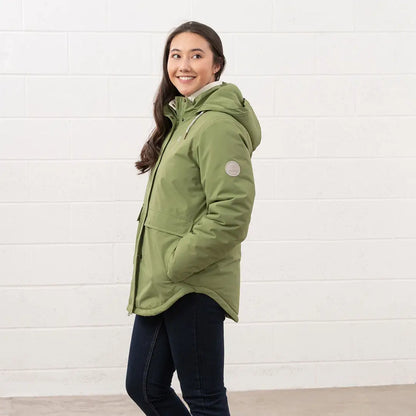 Woman in green Lighthouse Tess Ladies Coat perfect for country clothing and outdoor adventures