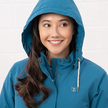 Smiling woman in Lighthouse Tess Ladies Coat, perfect for country clothing and outdoors