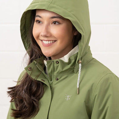 Woman in green Lighthouse Tess Ladies Coat, perfect country clothing for outdoors and hunting