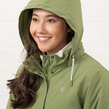 Woman in green Lighthouse Tess Ladies Coat, perfect country clothing for outdoors and hunting