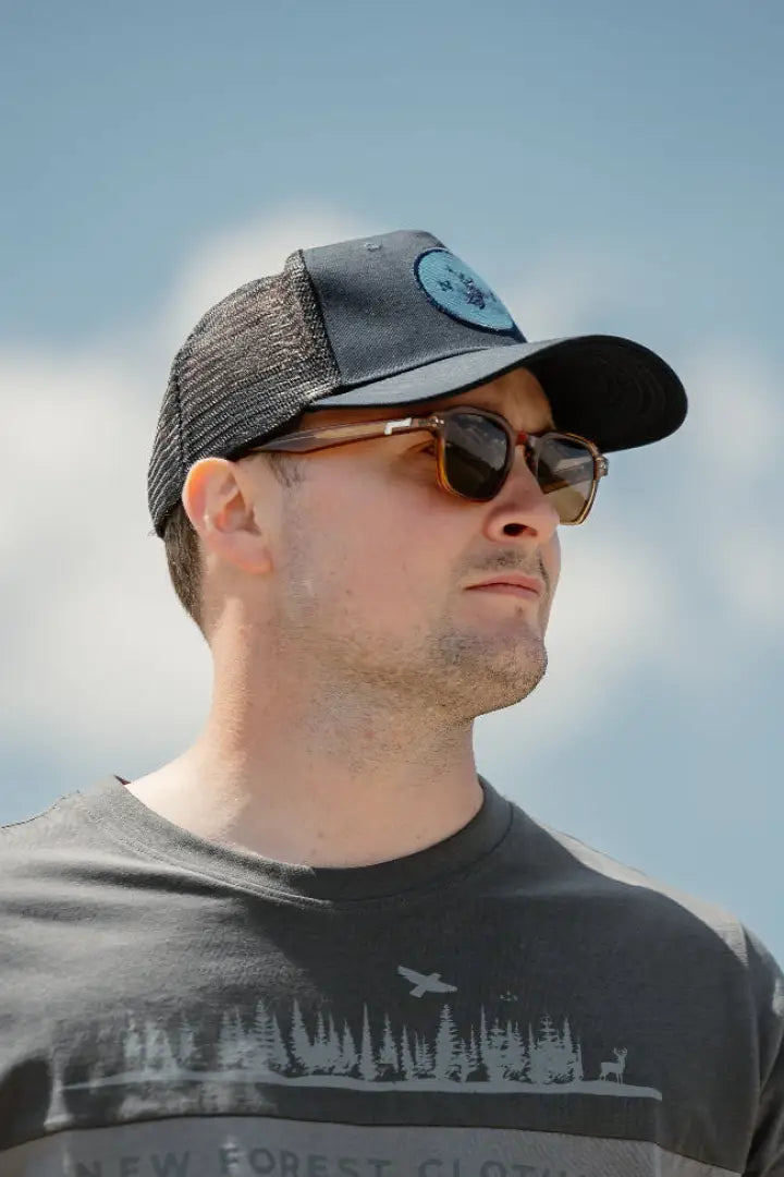 Man wearing sunglasses and a trucker hat with New Forest 2-Tone Graphic T-Shirt