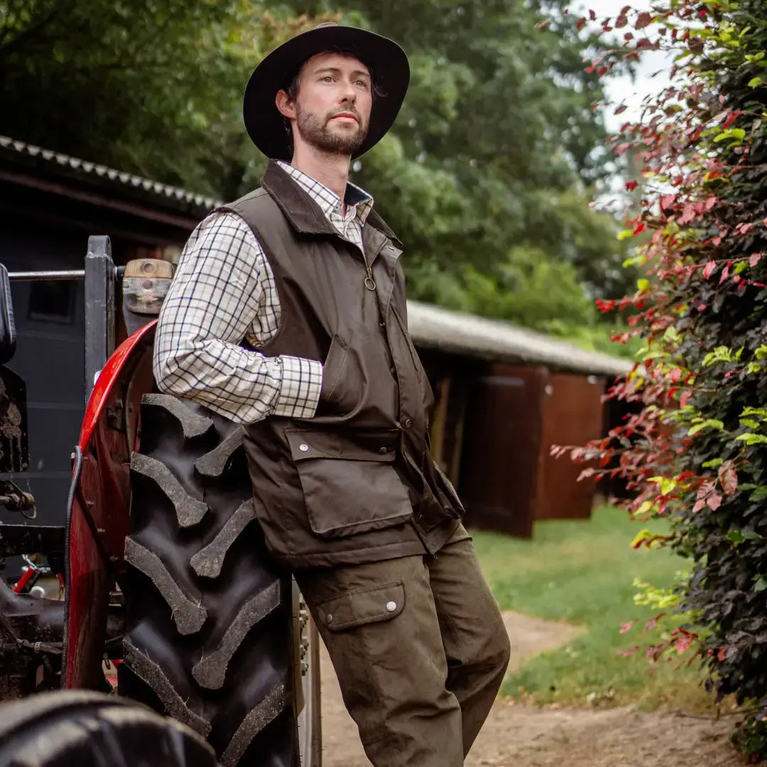 Man in outdoor attire wearing the New Forest Bushman Wax Gilet for tough weather