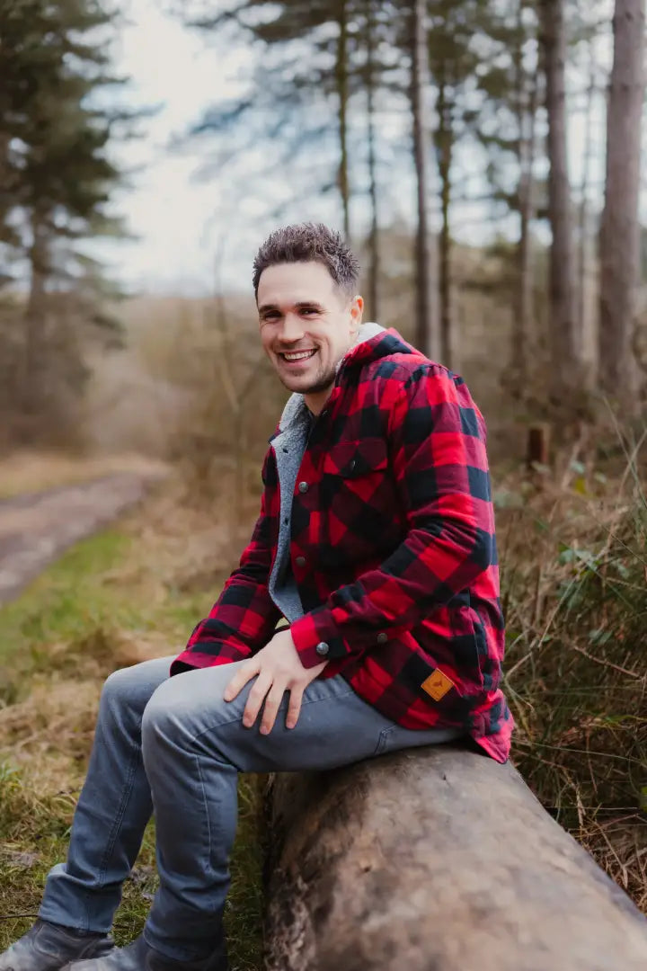 Man rocking a New Forest Canadian Sherpa Shirt in red and black flannel style