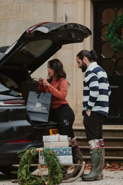 Car trunk loaded with gifts and a New Forest Classic Stripe Rugby Shirt peeking out