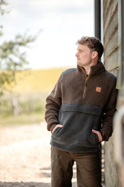 Man in brown and gray fleece pullover wearing New Forest Country Sport Trousers