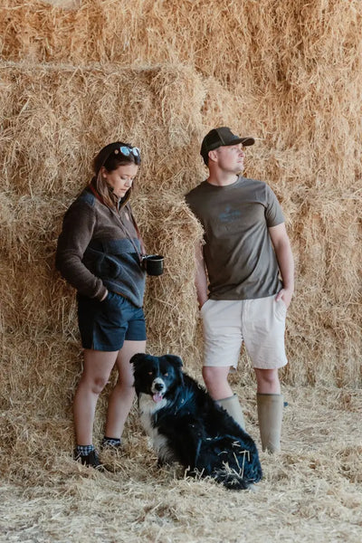 Rural scene with people and dog featuring a New Forest country sport iconic trucker hat