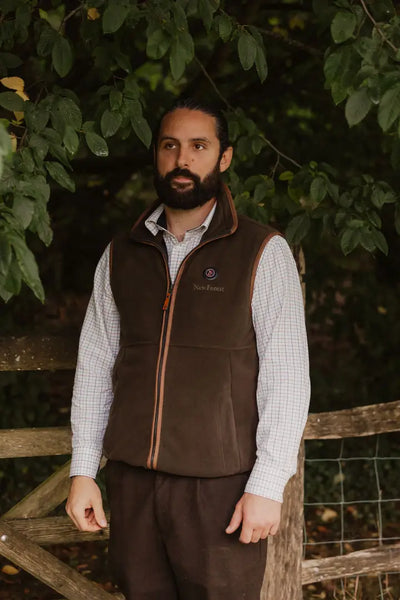 Brown vest with orange zipper, perfect for cozy warmth in the New Forest Heated Fleece Gilet